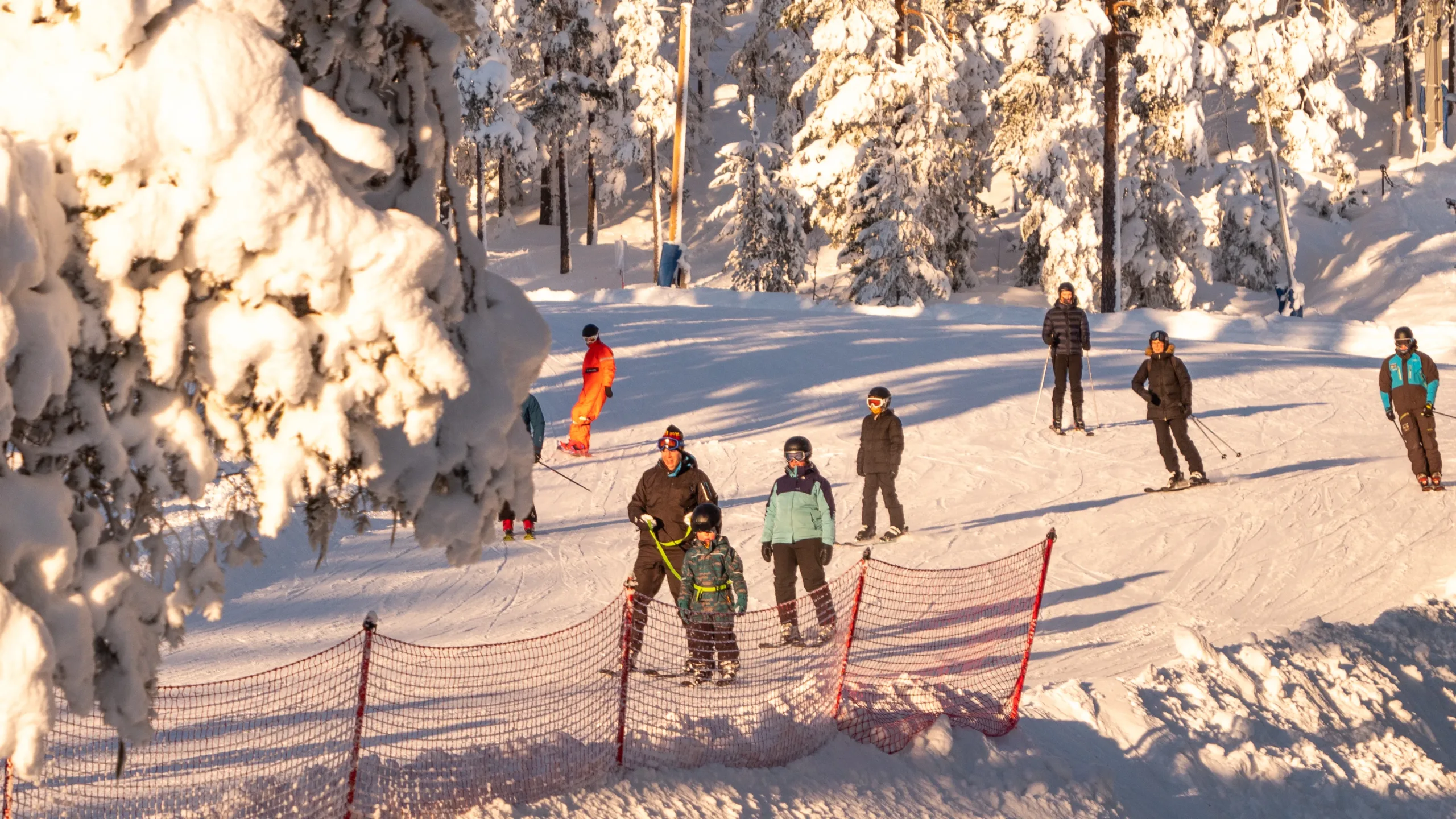 Järvsö in Sweden - a group of people skiing in the snow.