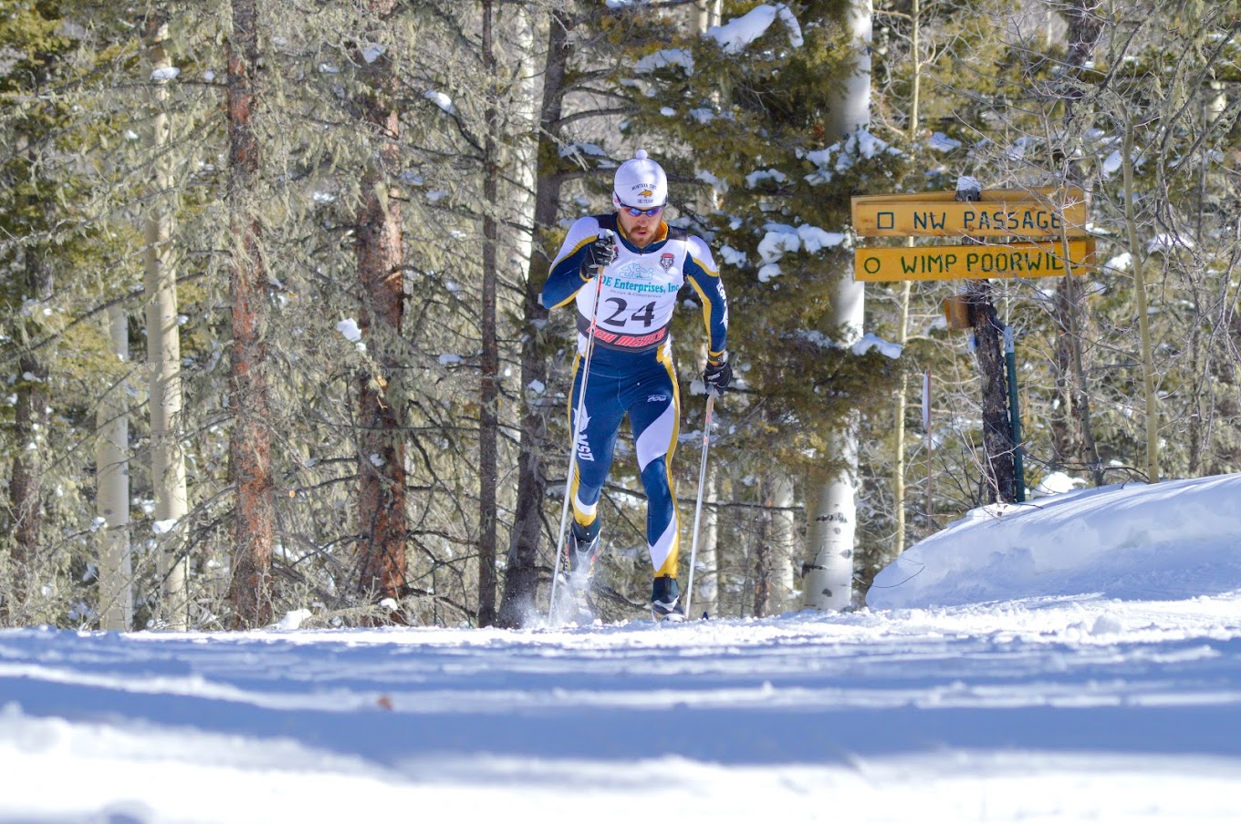 Enchanted Forest Cross Country Ski Area in USA - a man riding skis down a snow covered slope.