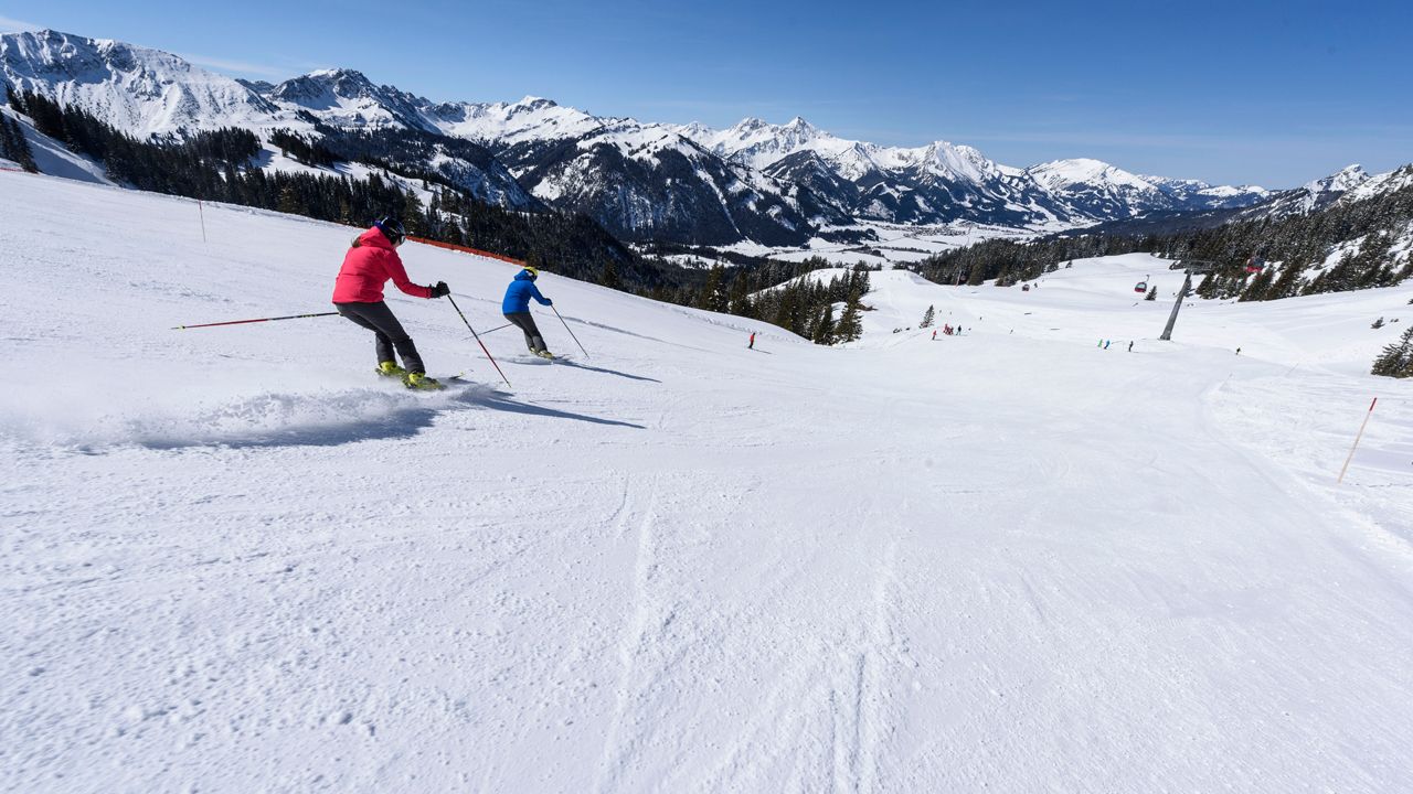 Füssener Jöchle – Grän in Austria - a person skiing down the side of a mountain.
