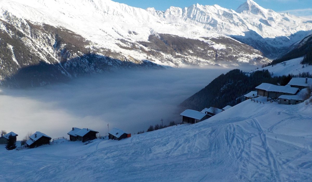 Espace Dent Blanche  |  Domaine skiable de Télé Evolène in Switzerland - a view of snow covered mountains from a ski slope.