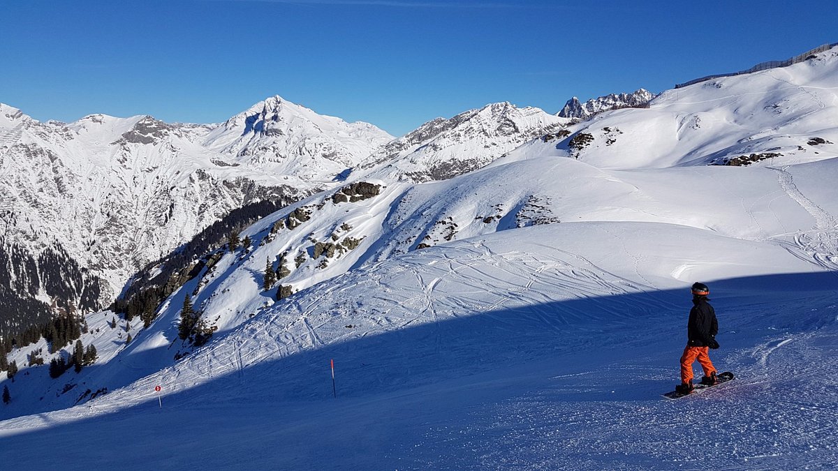 Sonnenkopf – Klösterle in Austria - a person on a snowboard in the snow.