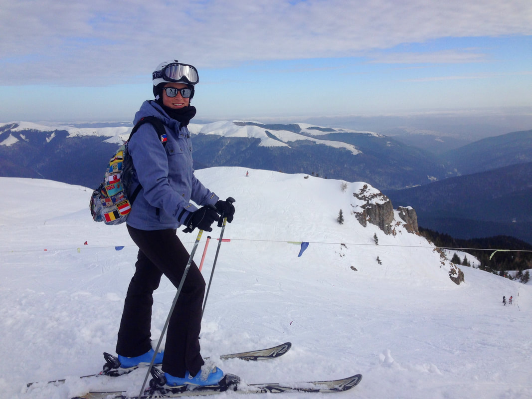Sinaia in Romania - a person standing on top of a snow covered mountain.