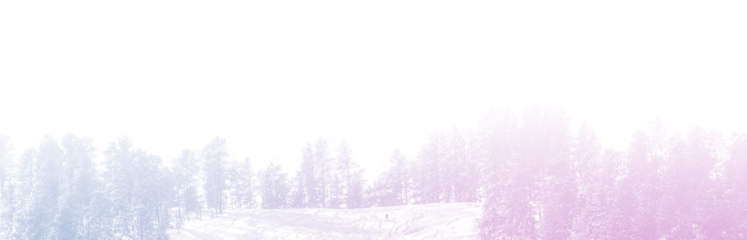 Breathtaking winter scenery at Terry Peak, Lead, South Dakota, showcasing snow-covered mountain slopes. A chalet can be seen nestled amidst this wintry wonder, suggestive of popular winter sports activities.