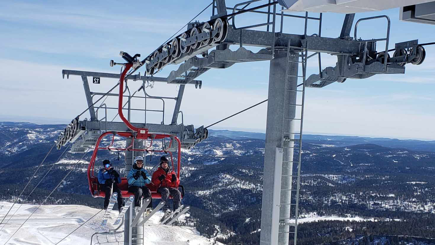 Terry Peak in USA - two people on a ski lift.