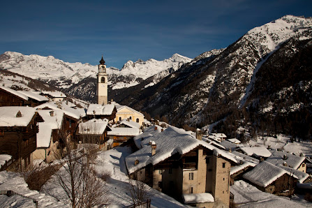Charming chalet nestled in the snowy landscape of Antagnod Pian Pera in Monte Rosa, Ayas, Aosta, Italy, providing a picturesque setting for winter sports enthusiasts.