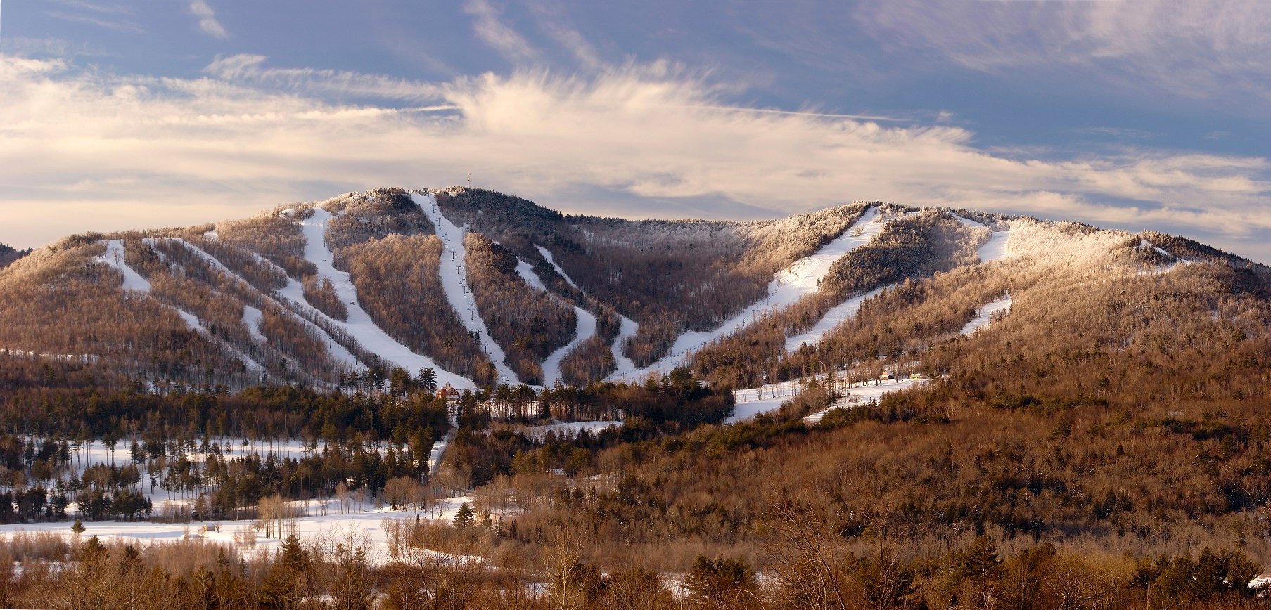 Ragged Mountain in USA - the mountains are covered in snow and trees.