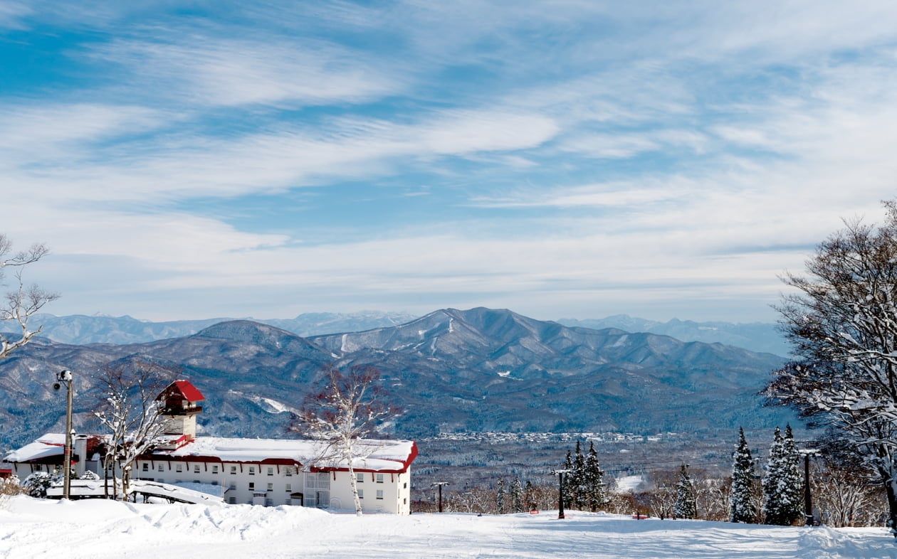 Myoko Akakura Kanko in Japan - blue sky with white clouds.