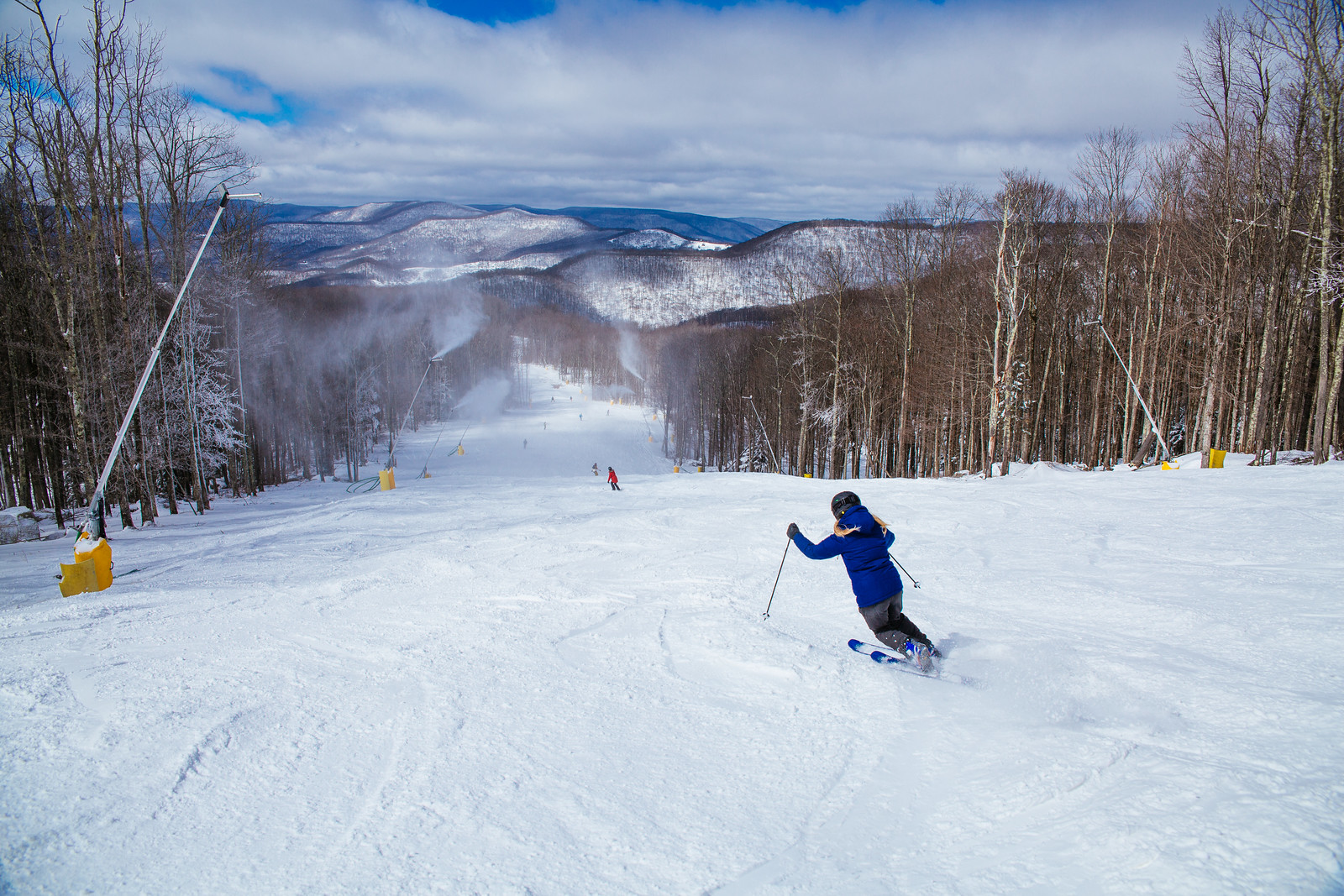 Snowshoe Mountain in USA - a person on skis going down a hill.