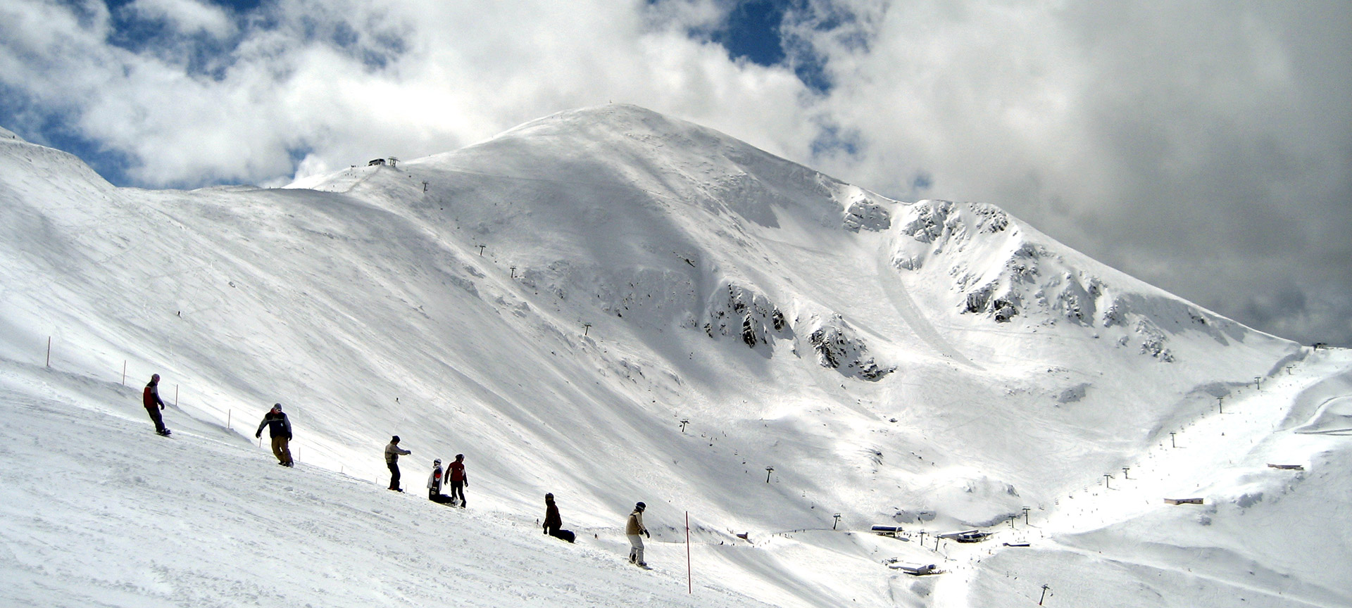 Valdezcaray in Spain - a group of people skiing down a snowy mountain.