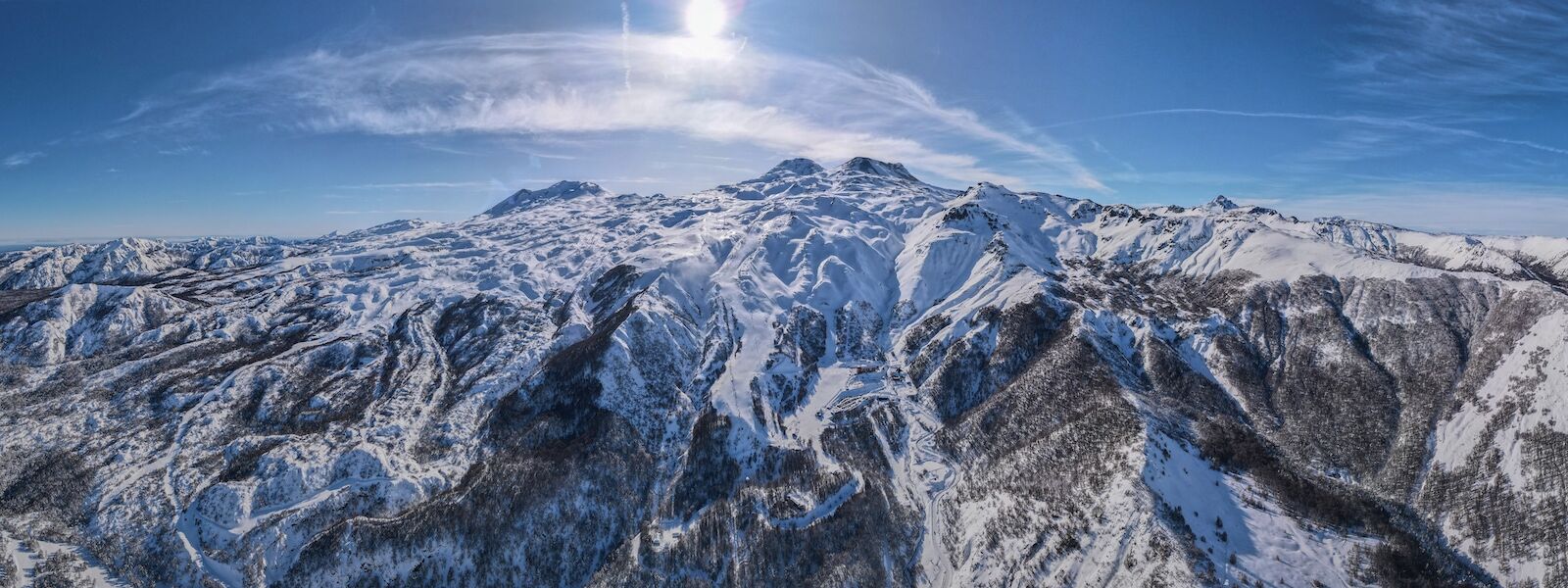 Nevados de Chillan in Chile - an aerial view of a snowy mountain range.