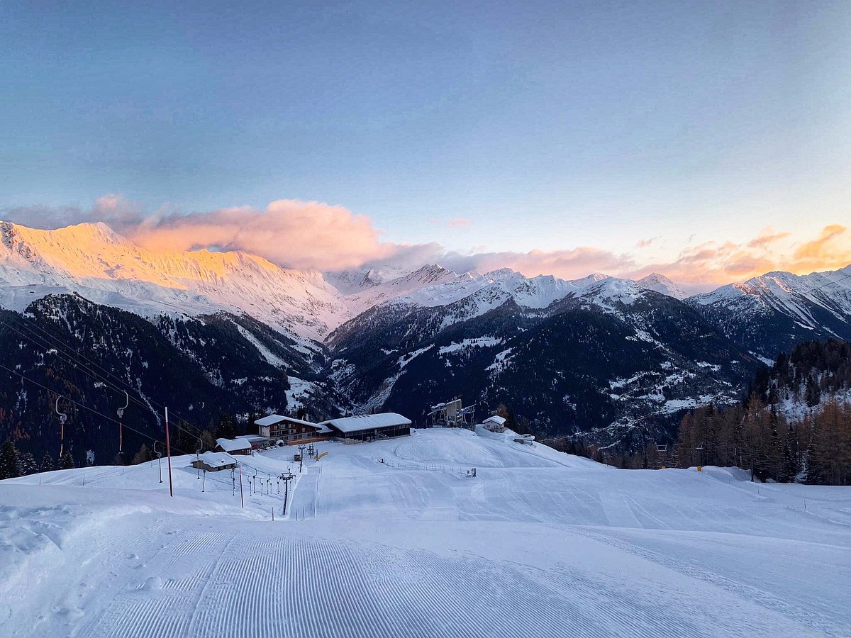 Funivie Airolo-Pesciüm in Switzerland - a snow covered ski slope with mountains in the background.