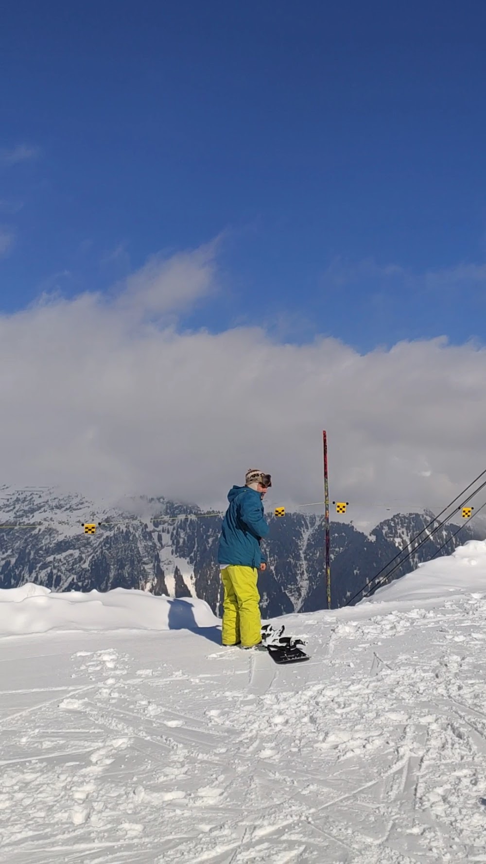 Funivie Airolo-Pesciüm in Switzerland - a person standing on top of a snow covered hill.