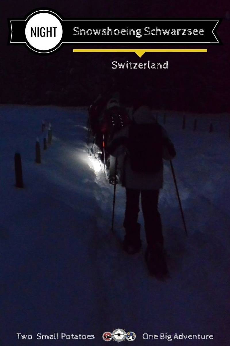 Schwarzsee in Switzerland - a person walking in the snow at night.