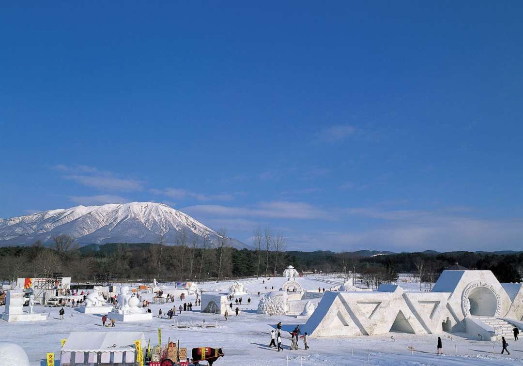 Iwate Kogen in Japan - a group of people standing on top of snow covered ground.