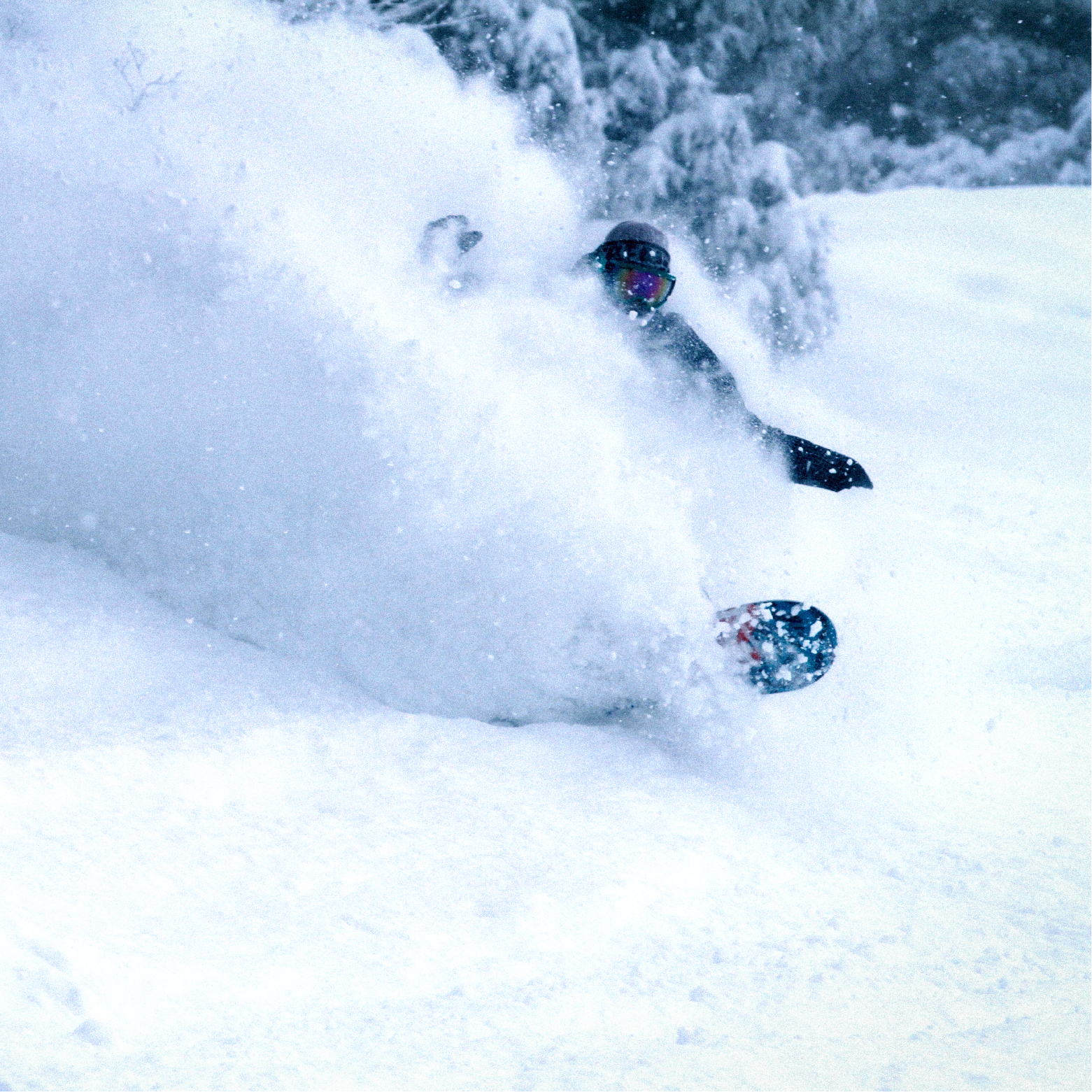 A snowboarder in action at Mizuho Highland in Chūgoku Shimane Japan displaying a perfect blend of talent and balance. The snowy mountainous backdrop enhances the dynamic winter sports scene.