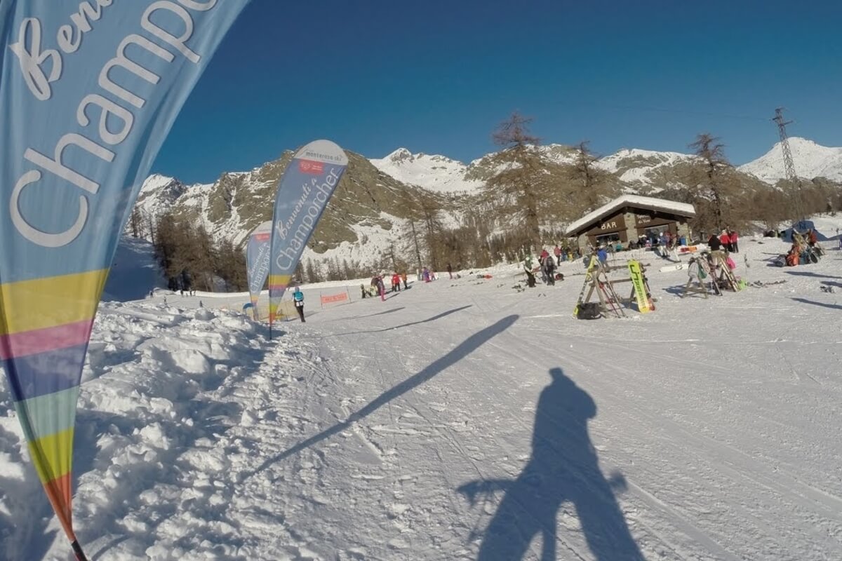 Champorcher in Italy - a group of people skiing down a snow covered slope.