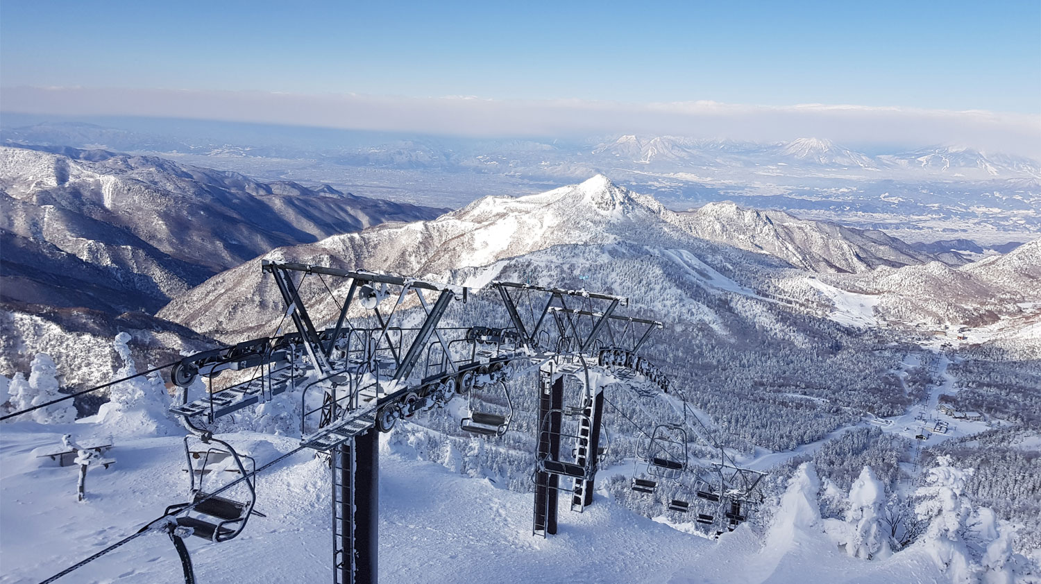Yakebitaiyama in Japan - a ski lift going up a snowy mountain.
