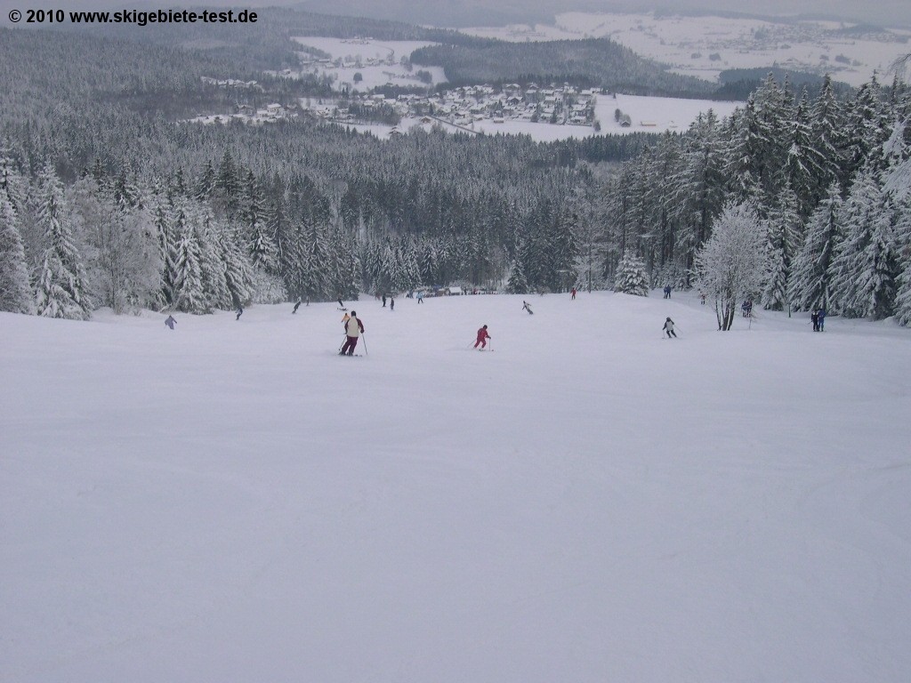 Pröller Skidreieck in Germany - a group of people skiing down a snowy slope.