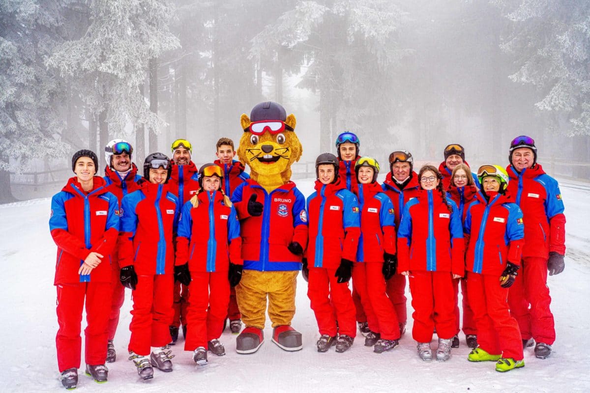 Pröller Skidreieck in Germany - a group of people posing for a picture in the snow.