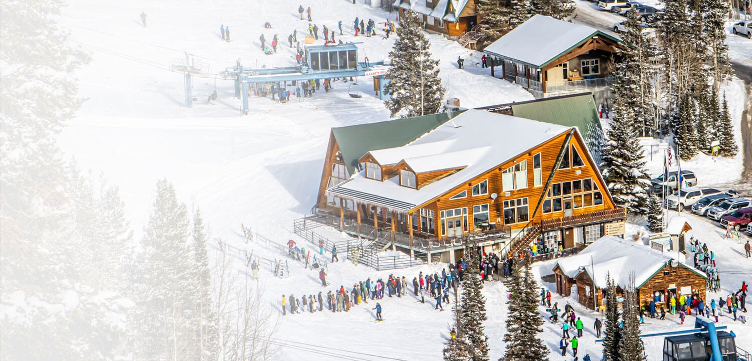Beaver Mountain in USA - a group of people skiing down a snowy slope.