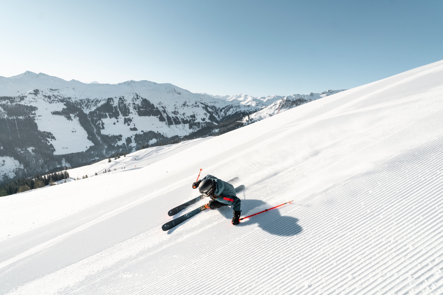 Skicircus Saalbach Hinterglemm Leogang Fieberbrunn in Austria - a man riding skis down a snowy slope.