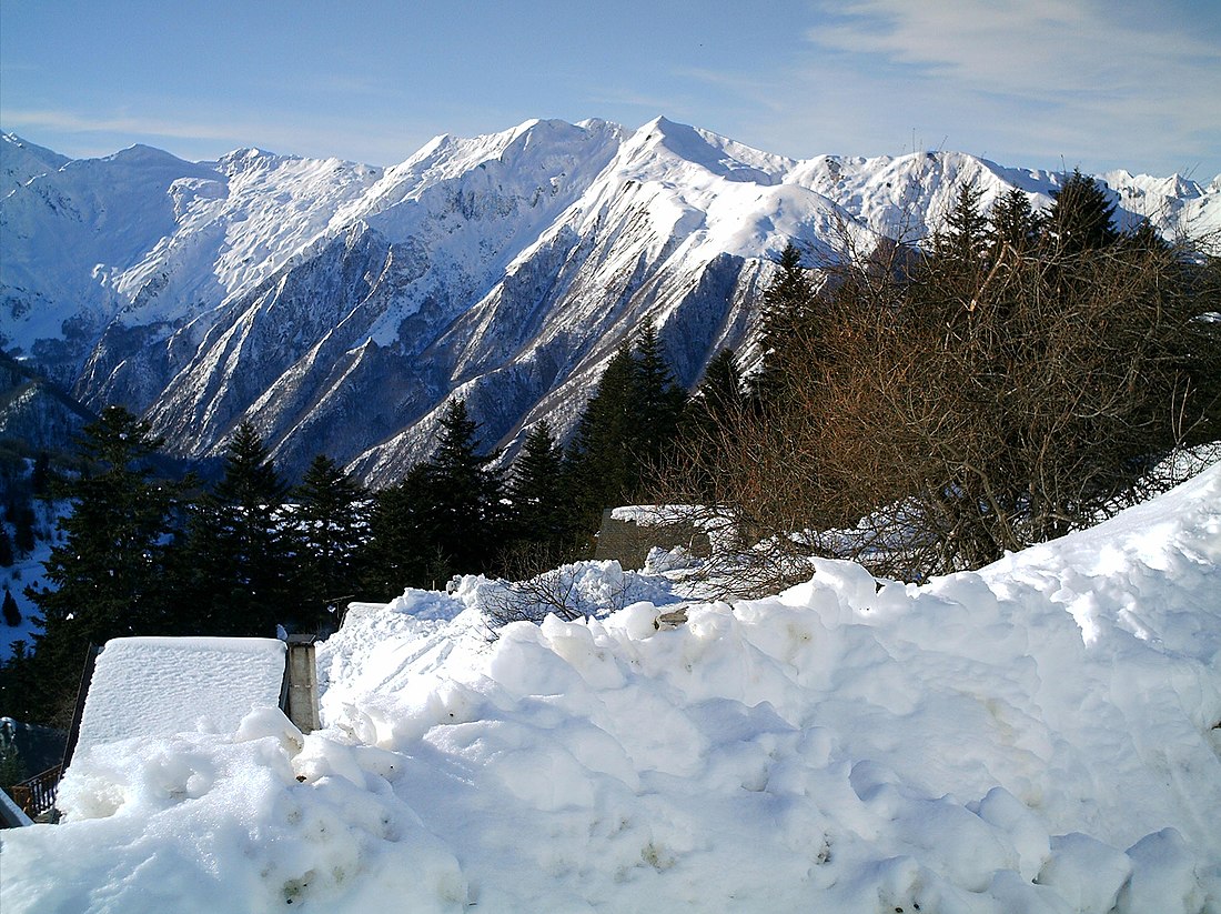 Guzet-Neige in France - a view of snow covered mountains and trees.