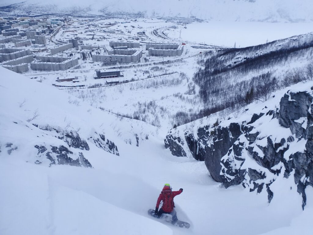 Big Wood in Russia - a person on a snowboard in the mountains.