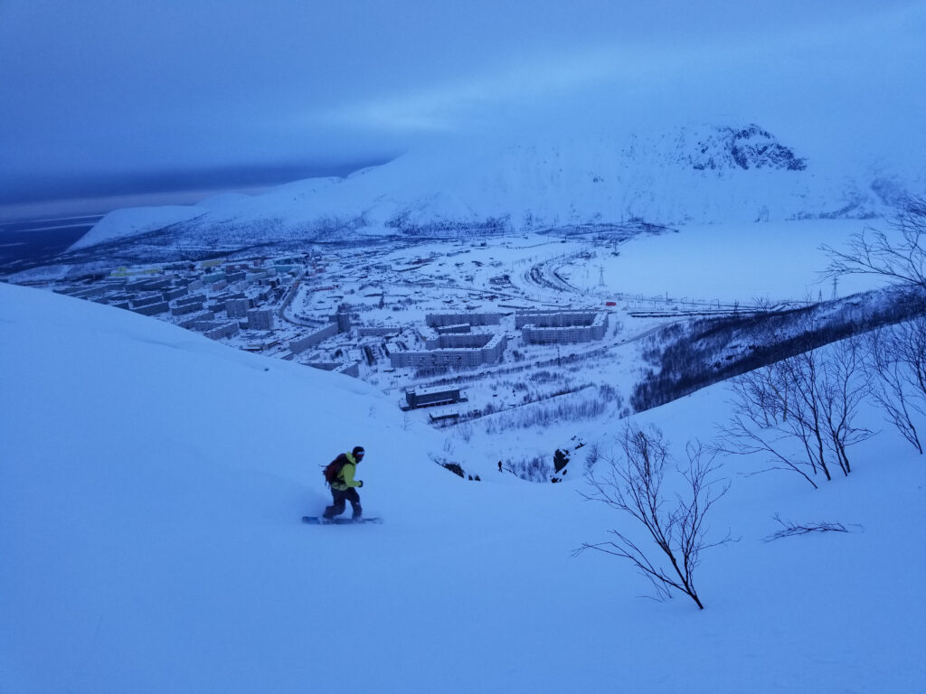 Big Wood in Russia - a person on a snowboard in the snow.