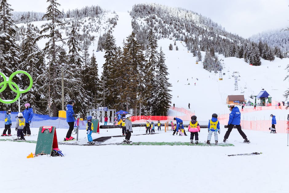 Whistler Blackcomb in Canada - a group of people skiing down a snow covered slope.