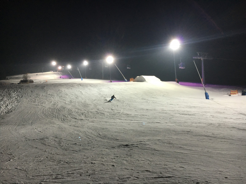 Grubigsteinbahnen Lermoos in Austria - a person riding a snowboard down a snowy slope.