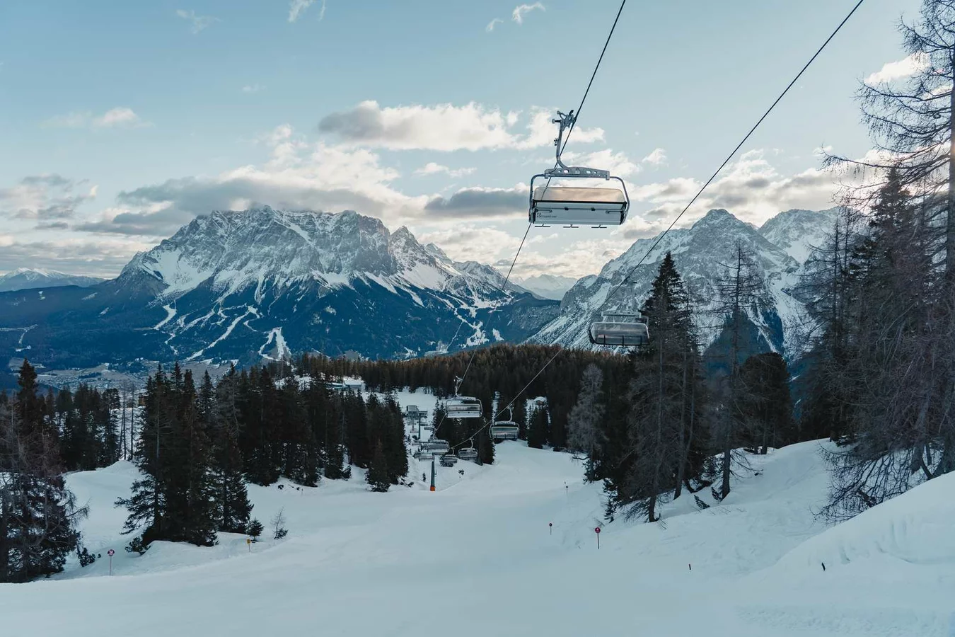 Grubigsteinbahnen Lermoos in Austria - a ski lift going up a snowy mountain.