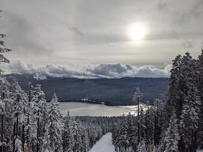 Winter sports scene at Kasberg - Grünau im Almtal ski resort in Austria, with stunning winter scenery featuring a snow-covered mountain.