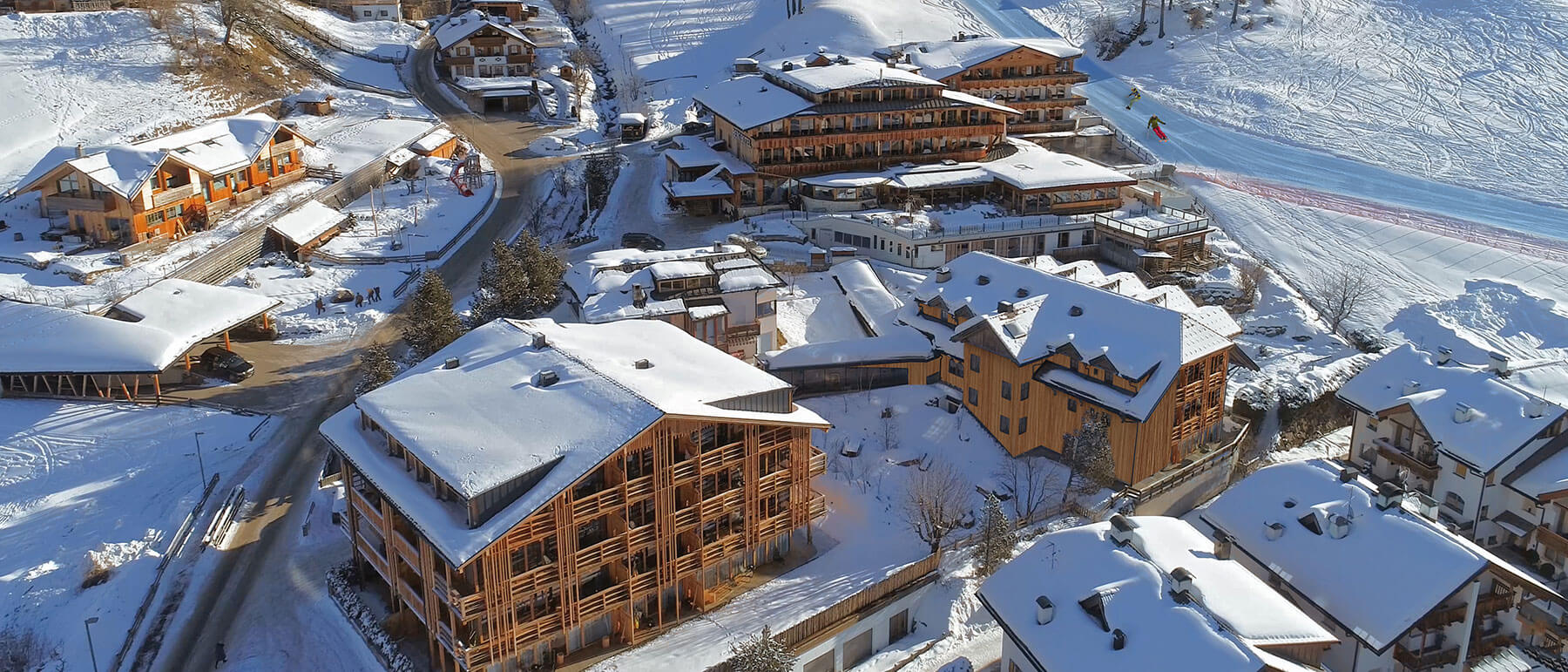 Padola Val Comelico in Italy: an aerial view of a ski resort in the mountains.