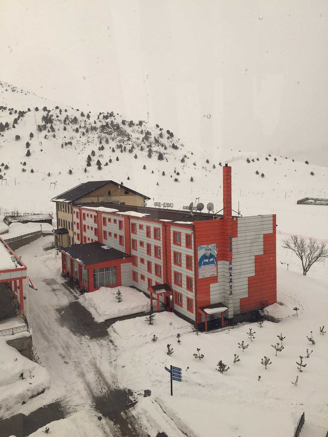 Safed Dara in Tajikistan: a red building in the middle of a snowy landscape.