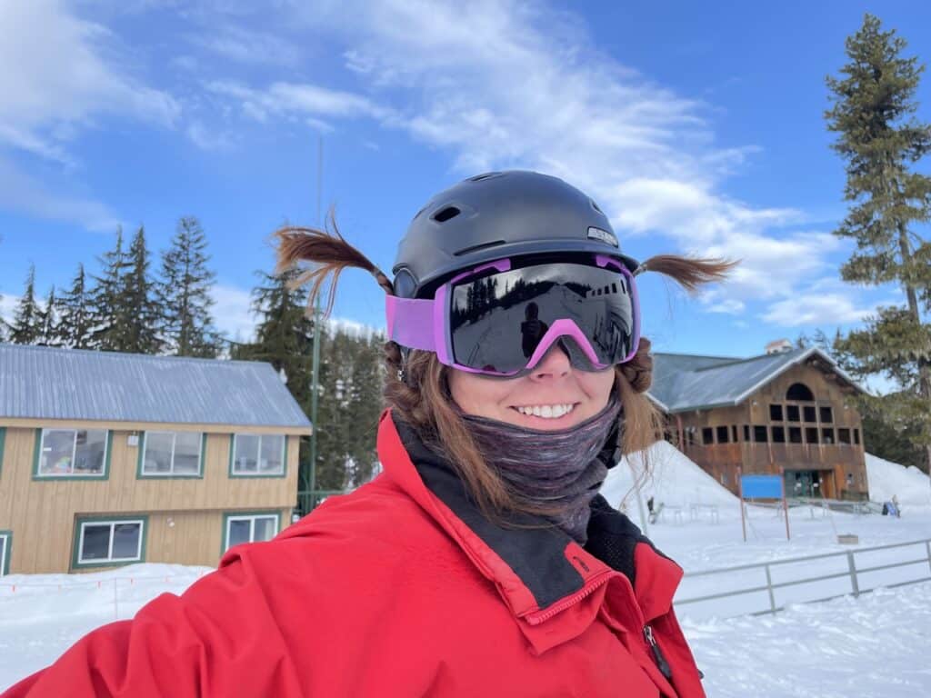 Willamette Pass Resort in USA - a woman wearing a helmet and goggles in the snow.