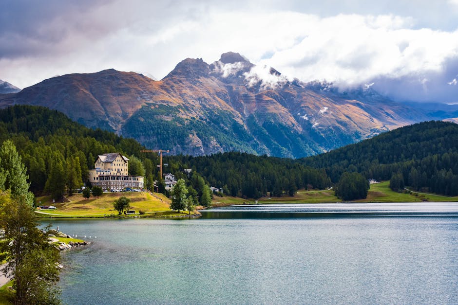 St. Moritz Corviglia in Switzerland - a lake with mountains in the background.