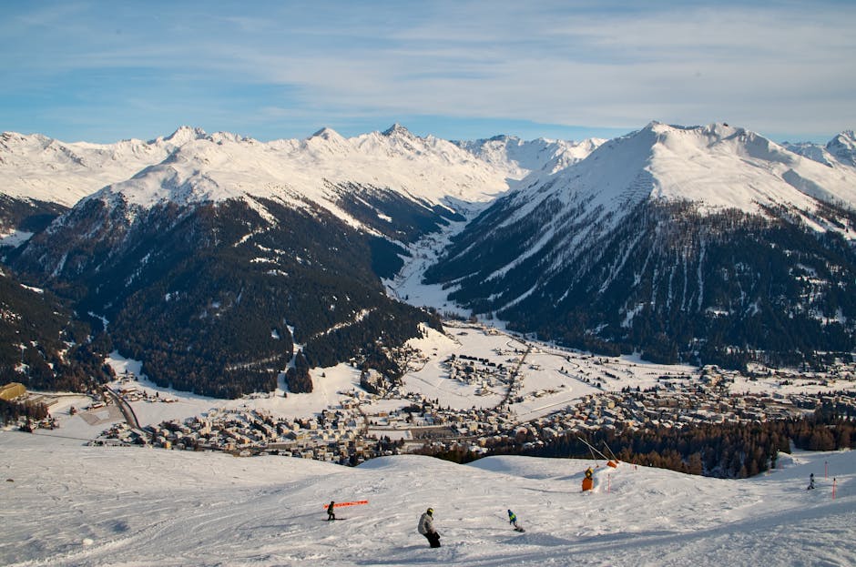 St. Moritz Corviglia in Switzerland - a group of people skiing down a snowy slope.
