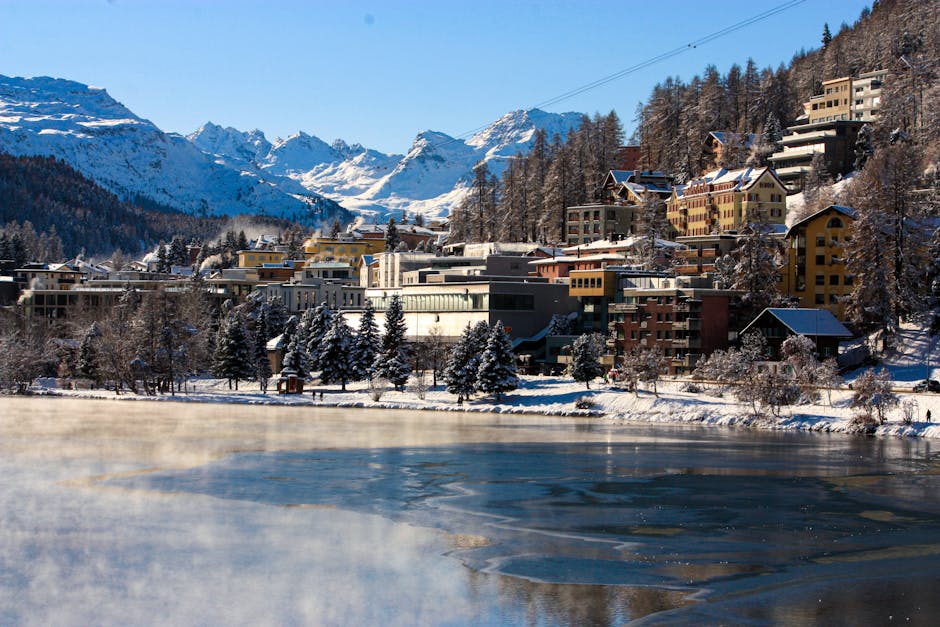St. Moritz Corviglia in Switzerland - a frozen lake in the middle of a mountain town.