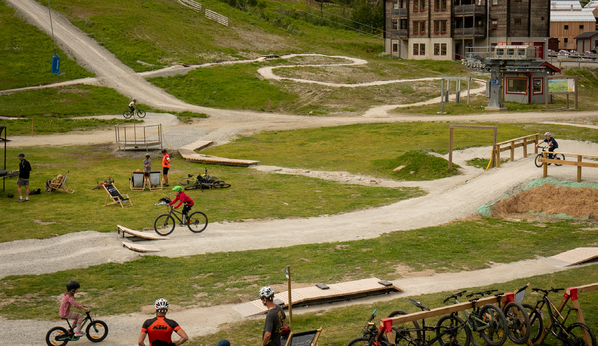 Tänndalen in Sweden - a group of people riding bikes down a hill.
