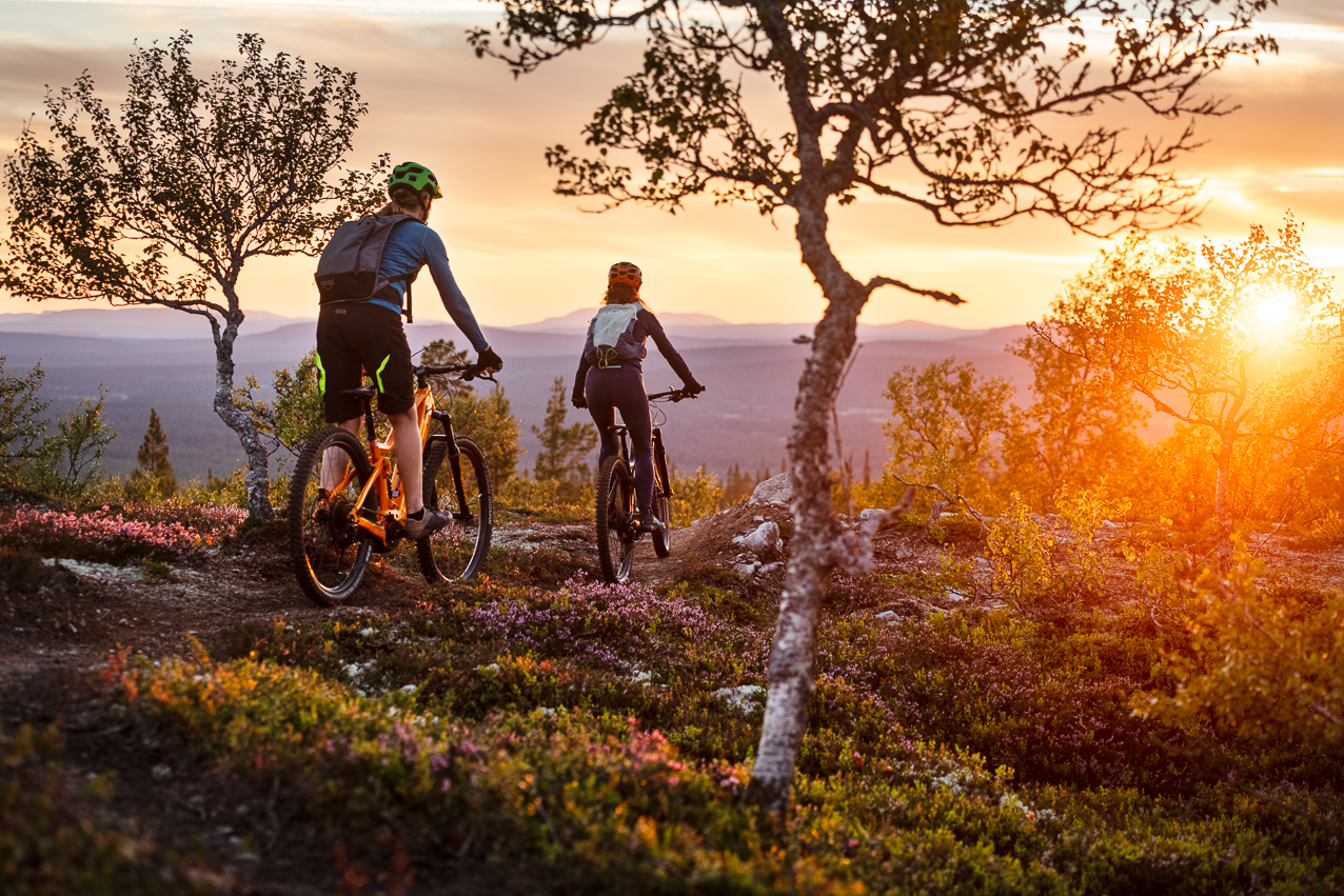 A mountain biker riding through the beautiful landscape of Lofsdalen in Jämtland Northern Sweden. The terrain is rugged but serene with no other visible elements.