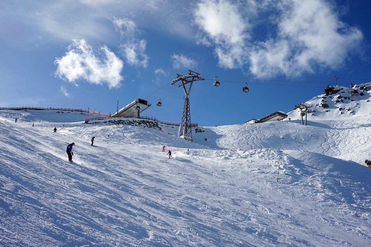 Sölden in Austria - a group of people skiing down a snow covered slope.