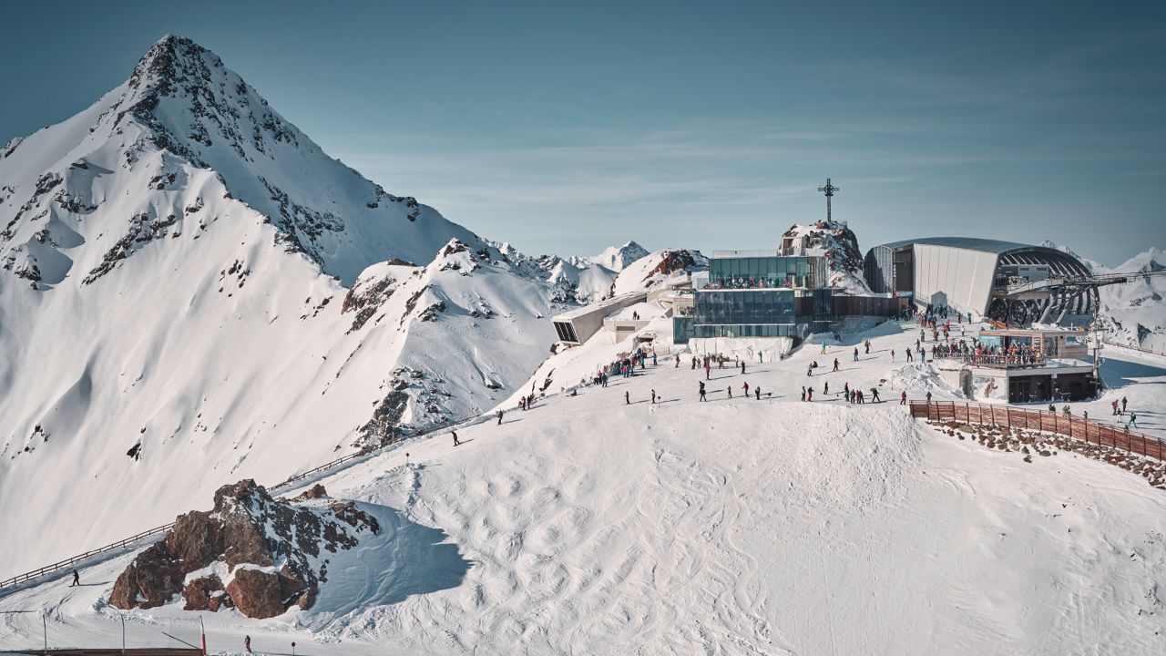 Sölden in Austria: a snowy mountain with a building in the background.