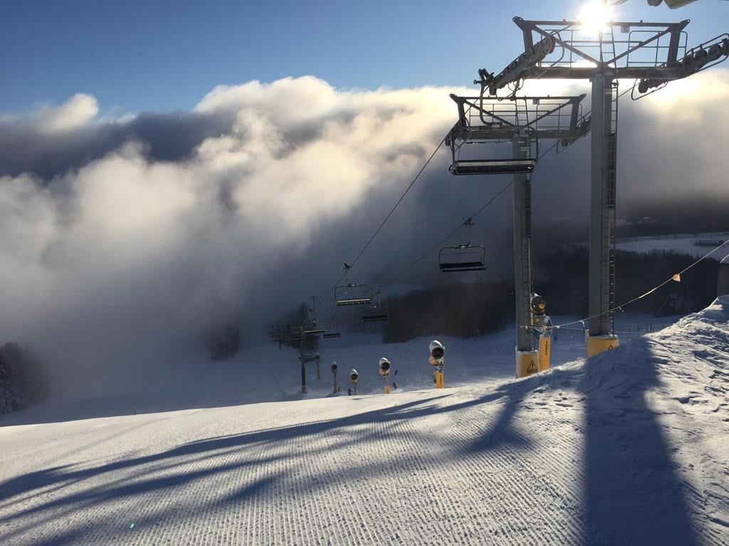 Mount St. Louis Moonstone in Canada - a ski lift going up a snowy hill.