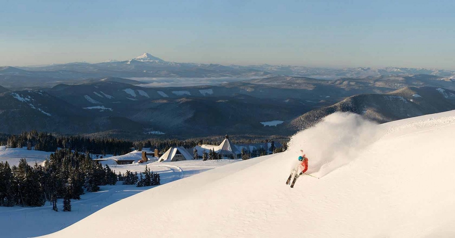 Timberline Mountain in USA - a person skiing down a snow covered mountain.
