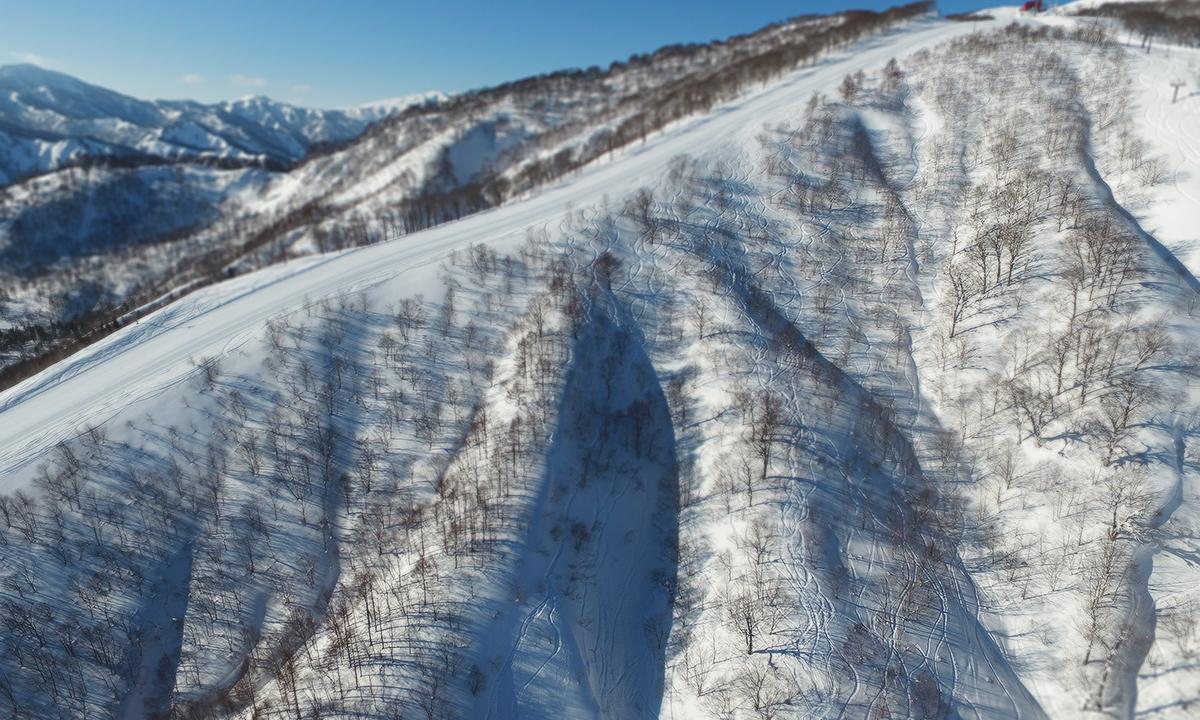 Geto Kogen in Japan - an aerial view of a ski slope in the mountains.