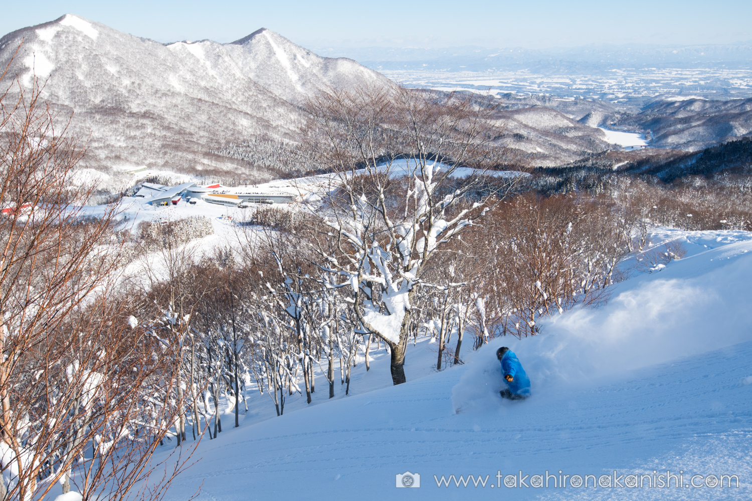 Geto Kogen in Japan - a person on a snowboard in the snow.