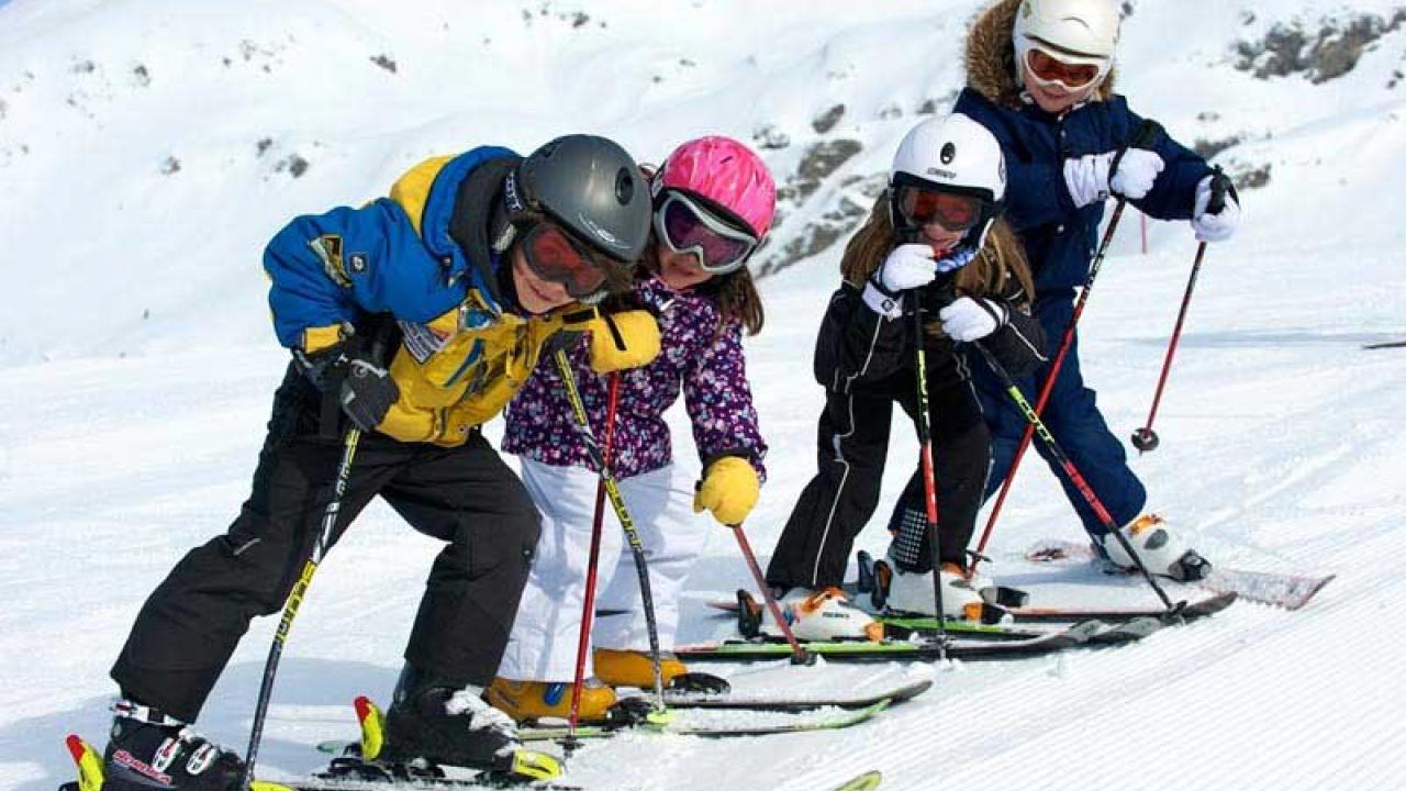 Foppolo - Carona - Brembo Ski in Italy - a group of people skiing down a snow covered mountain.