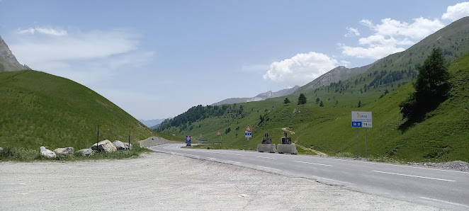 Image of a charming chalet near a ski resort in La Colmiane, Alpes-Maritimes, France. Majestic mountain serves as a backdrop, while a ski lift illustrates the area's recreational offerings. Basking in abundant sunshine, it's a perfect day for skiing.