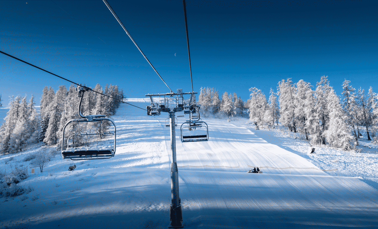 La Colmiane in France - a ski lift going down a snowy slope.