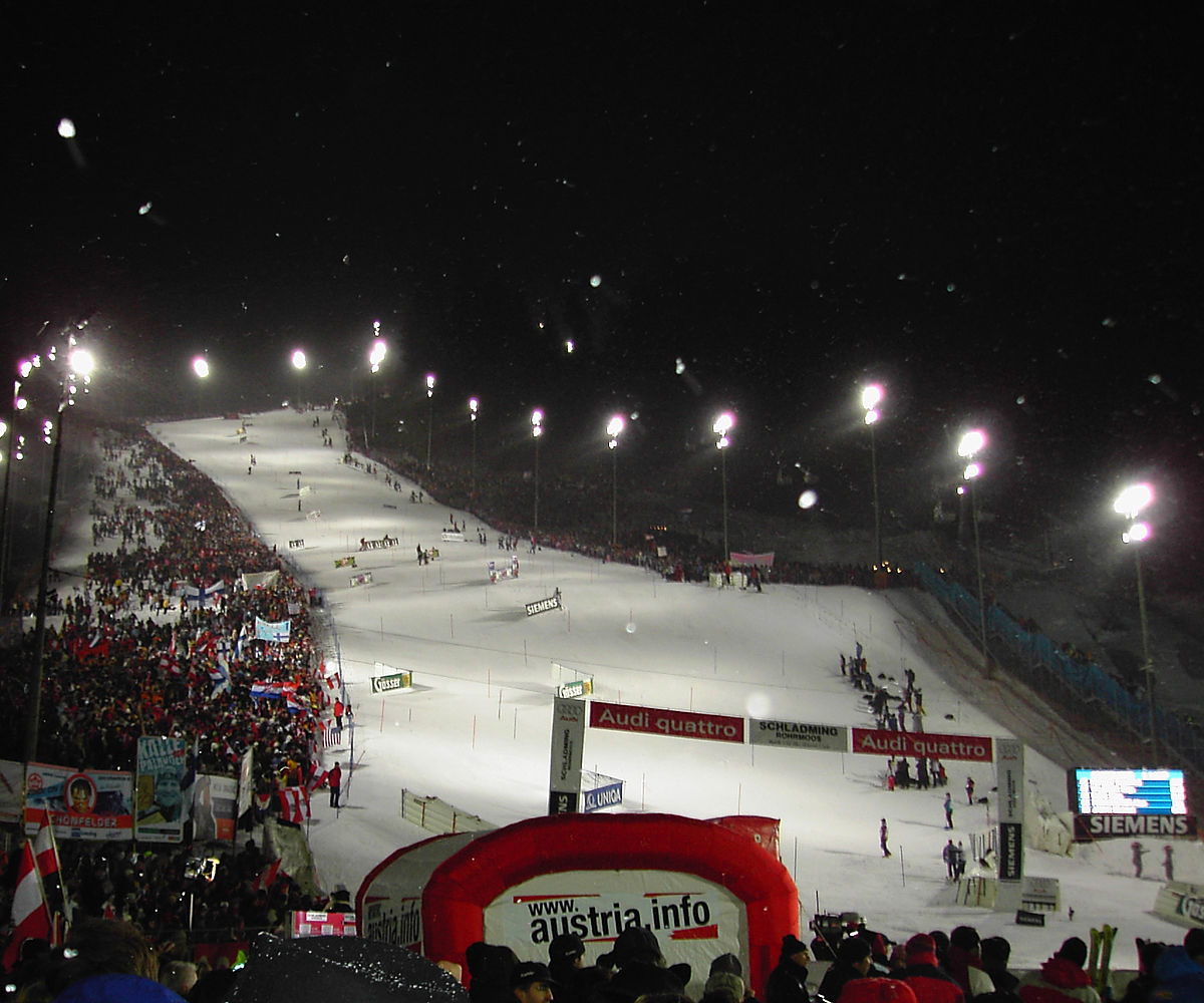 Planai Schladming in Austria - a crowd of people watching a snowboarder.